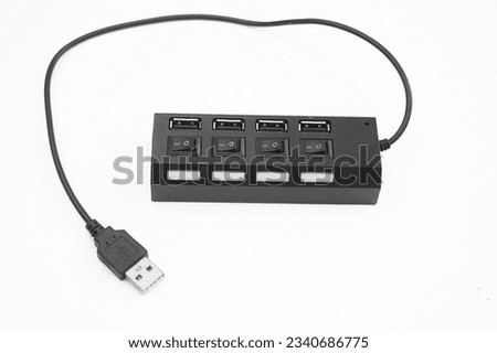 Portable Universal Serial Bus or USB with four ports with on off switch on white background