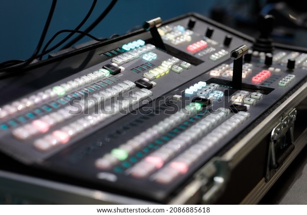 Portable video switcher in\
protective hard case during the live broadcast of the event.\
Selective focus.