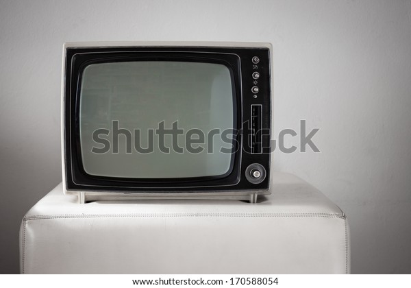 Portable vintage\
television on white\
background