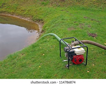 Portable Water Pump On Country Pond Coast