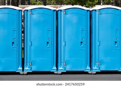 Portable wc. Public mobile toilet in the street. Transportable latrine