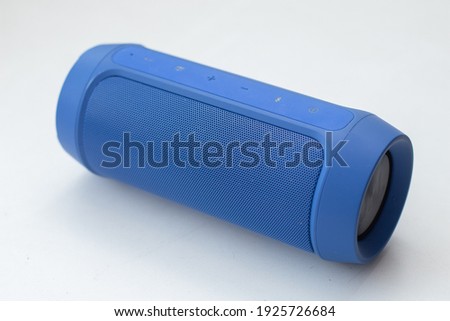 Portable wireless bluetooth speaker on white background.