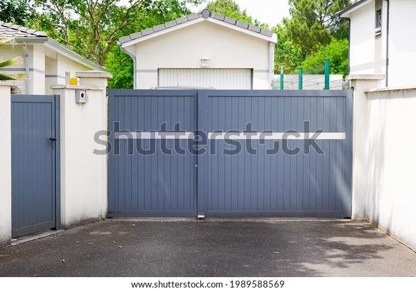 portal street suburb home grey house wicket gate\
garden access door