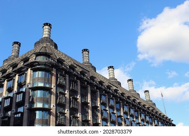 Portcullis House, London on a sunny day with blue skies at late afternoon in westminster next to the thames