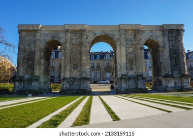The Porte de Mars (Gate of Mars), a 1700 year-old, 3th century vestige, and an ancient Roman triumphal arch, currently located at the end of the Hautes Promenades, in Reims, in the Northeast of France - Shutterstock ID 2133159115