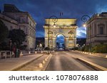 The Porte du Peyrou -  a triumphal arch in Montpellier, France at dusk