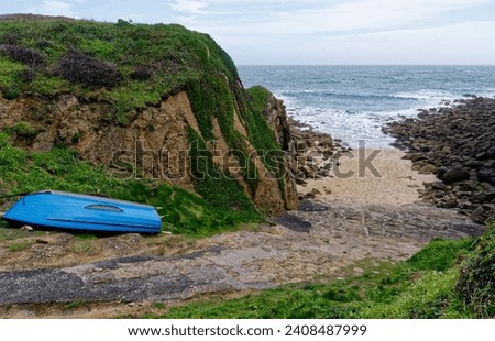 Porthgwarra Slipway and beach with blue boat, West Penwith, Cornwall, UK