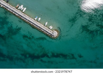 Porticciolo di Pacengo lago di garda (Garda Lake, Province of Verona, Italy) drone view (aerial) Family walking the pier (marina) - Powered by Shutterstock