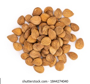 Portion of Apricot Kernels isolated on white background as detailed close up shot (selective focus)