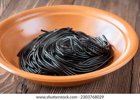 Similar – Image, Stock Photo Squid ink spaghetti and tomatoes