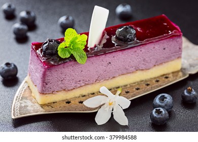 Portion Of Blueberry Mouse Cake On Old Antique Cake Slicer 