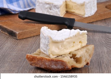 Portion Of Camembert On A Slice Of Bread Close-up