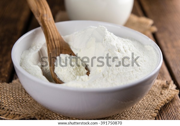 Portion of Milk Powder (selective focus) on an old
wooden table