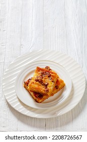 Portion Of Pumpkin Chocolate Chips Sheet Cake On White Plate On White Wood Table, Vertical View, Free Space