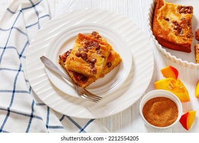 Portion Of Pumpkin Chocolate Chips Sheet Cake On White Plate On White Wood Table, Landscape View