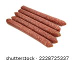 Portion of thin smoked meat sticks isolated on white background