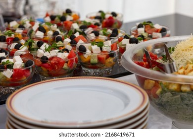 Portioned Salads And Empty Plates On The Buffet Table. Beautiful Serving And Cataring. Close-up.