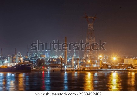 PORT-JEROME, FRANCE - APRIL 19, 2019: night view of a petrochemical plant on the banks of the Seine River