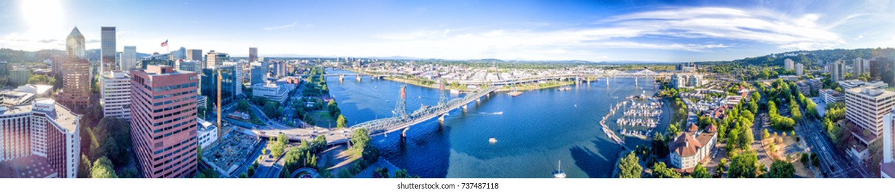 PORTLAND, OR - AUGUST 18, 2017: Aerial view of cityscape and Willamette River. Portland attracts 5 million tourists annually.