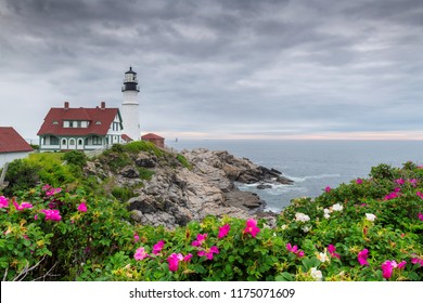 Portland Head Light At Summer Cloudy Day And Flowers In Maine, New England.