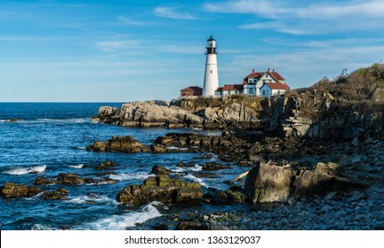 Portland Headlight Standing Tall Off The Coast Of Cape Elizabeth, Maine. An Historic Light House, It Is The Oldest Light House In The State Of Maine, Standing At The Edge Of Jagged Cliffs. 