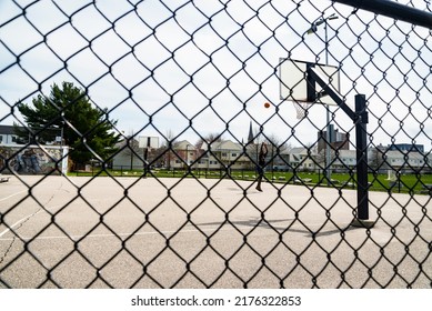 Portland, Maine -April 4, 2022: Cute Teenager Iplaying Basketball. Young Boy With Red Ball Shooting On The City Court. Hobby For Kids, Active Lifestyle. Portland Maine