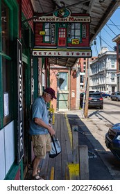 Portland, Maine. July 6th, 2021. A Patron Leaving The Harbor Fish Market With Summer Dinner Items. 