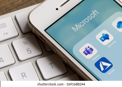 Portland, OR, USA - Apr 2, 2020: Microsoft Teams mobile app icon is seen on an iPhone with other Microsoft applications. Teams is a unified team communication and collaboration platform.