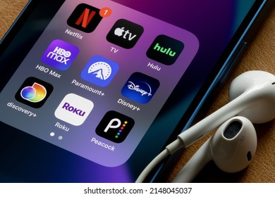 Portland, OR, USA - Apr 20, 2022: Assorted Streaming Apps Are Seen On An IPhone, Including Netflix, Apple TV, Hulu, HBO Max, Paramount Plus, Disney Plus, Discovery Plus, Roku, And Peacock.