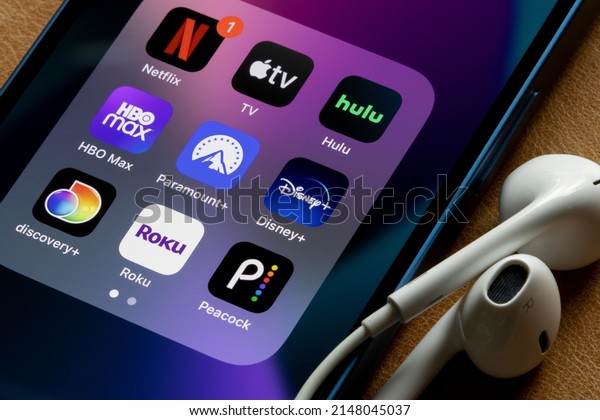 Portland,\
OR, USA - Apr 20, 2022: Assorted streaming apps are seen on an\
iPhone, including Netflix, Apple TV, Hulu, HBO Max, Paramount Plus,\
Disney Plus, Discovery Plus, Roku, and\
Peacock.