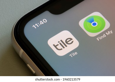 Portland, OR, USA - Apr 21, 2021: Tile And Find My App Icons Are Seen On An IPhone. Tile, The Tracking Device Maker, Bashes Apple's Newly-introduced Lost Item Finder AirTag As Unfair Competition.