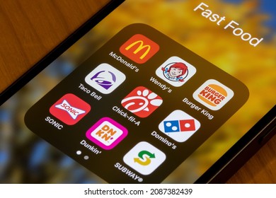 Portland, OR, USA - Dec 6, 2021: Assorted American fast food restaurant apps are seen on an iPhone - McDonald's, Wendy's, Burger King, Taco Bell, Chick-fil-A, Domino's, SONIC, Dunkin', and Subway.