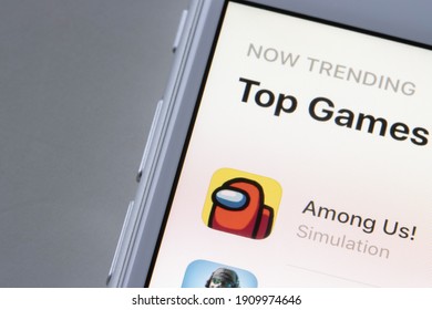 Portland, OR, USA - Feb 1, 2021: Among Us app icon is seen on an iPhone. Among Us is an online multiplayer social deduction game developed and published by American game studio Innersloth.