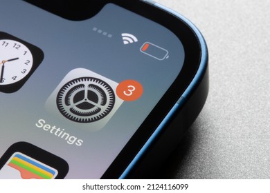 Portland, OR, USA - Feb 14, 2022: Closeup Of The IOS Settings App Icon With A Notification Badge Seen On An IPhone 13 Mini.
