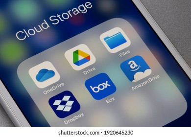 Portland, OR, USA - Feb 19, 2021: Assorted cloud storage apps are seen on an iPhone - Microsoft OneDrive, Google Drive, Apple Files, Dropbox, Box, and Amazon Drive.