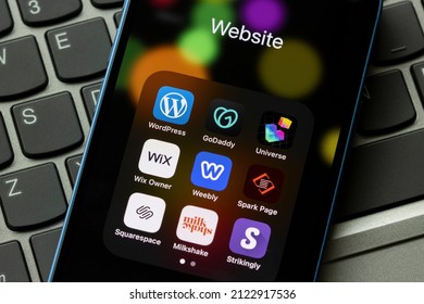 Portland, OR, USA - Feb 3, 2022: Assorted website builders apps are seen on an iPhone - WordPress, GoDaddy, Universe, Wix, Weebly, Adobe Spark Page, Squarespace, Milkeshake, and Strikingly.