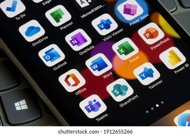 Portland, OR, USA - Feb 8, 2021: Microsoft 365 apps are seen on an iPhone - Office, Word, Excel, PowerPoint, Outlook, OneNote, Visio Viewer, Power Apps, Teams, SharePoint, Yammer, Power BI, etc.
