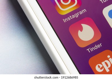 Portland, OR, USA - Feb 8, 2021: Tinder App Icon Is Seen On An IPhone. Tinder Is A Geosocial Networking And Online Dating App That Allows Users To Anonymously Swipe To Like Or Dislike Other Profiles.