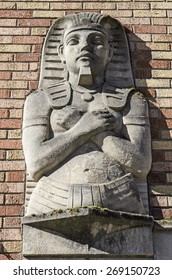 Portland, OR, USA - February 21, 2014:  King tut style Egyptian style statue stands at the entrance to Portland State University's Blackstone housing building