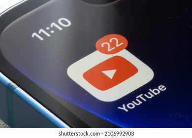 Portland, OR, USA - Jan 15, 2022: Closeup Of The YouTube Mobile App Icon With A Badge Indicating 22 New Notifications Seen On An IPhone. Big Tech Social Media Concept.