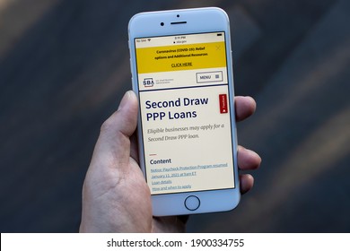 Portland, OR, USA - Jan 22, 2021: The U.S. Small Business Administration Website's Second Draw PPP Loans Page Is Seen On A Phone. PPP Loan Helps Businesses Keep Their Workforce Employed.