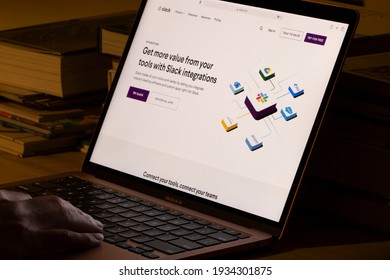 Portland, OR, USA - Mar 11, 2021: A Man Browses The Slack Website, Which Advertises Slack Integrations With Other Industry Leading Apps Like Zoom, Workday, Outlook, Google Drive, Jira, And Salesforce.