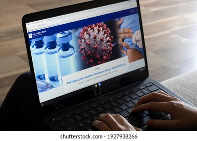 Portland, OR, USA - Mar 2, 2021: A woman browses the FDA website to learn more about COVID-19 vaccines. FDA has issued emergency use authorization for Janssen vaccine, the third COVID-19 vaccine. 