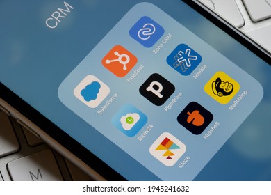 Portland, OR, USA - Mar 28, 2021: Assorted CRM mobile apps are seen on an iPhone - Salesforce, HubSpot, Zoho CRM, Bitrix24, Pipedrive, Nimble, Cloze, Nutshell, and Mailchimp.