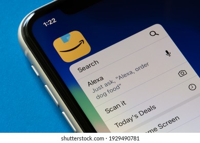 Portland, OR, USA - Mar 4, 2021: The Amazon app icon and its quick actions menu are seen on an iPhone, with functions including Alexa voice control service.