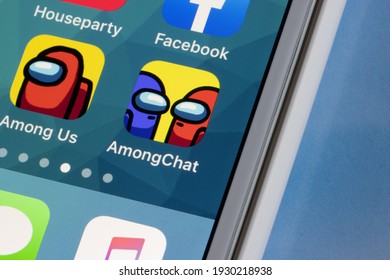 Portland, OR, USA - Mar 5, 2021: AmongChat and Among Us app icons are seen on an iPhone. AmongChat is a voice chat app for friends from Among Us, and a friend finder app.