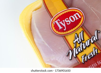 Portland, OR, USA - May 18, 2020: Closeup Of American Meat Processing Company Tyson Foods Branded Boneless Skinless Chicken Thigh Product Isolated On A White Background. 