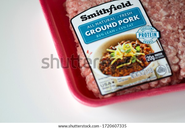 Portland, OR, USA - May 2, 2020: American\
meat-processing company Smithfield Foods branded ground pork\
product isolated on white.  Several Smithfield plants shut down due\
to a coronavirus\
outbreak.