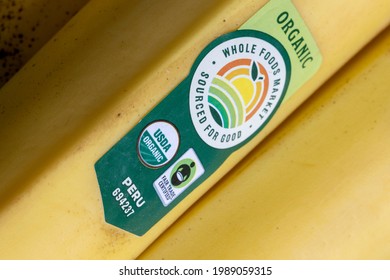 Portland, OR, USA - May 3, 2021: Closeup Of The Sticker On A USDA Certified And Fair Trade Certified Banana Imported From Peru.