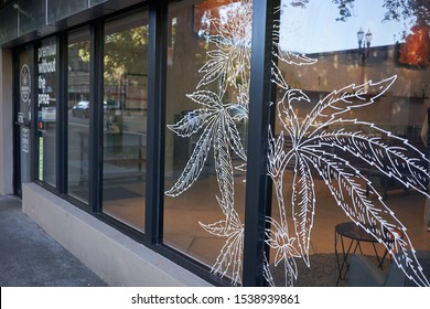 Portland, OR, USA - Oct 1, 2019: Marijuana Illustration Is Seen On The Storefront Window At A Recreational Marijuana Dispensary In Portland, Oregon.